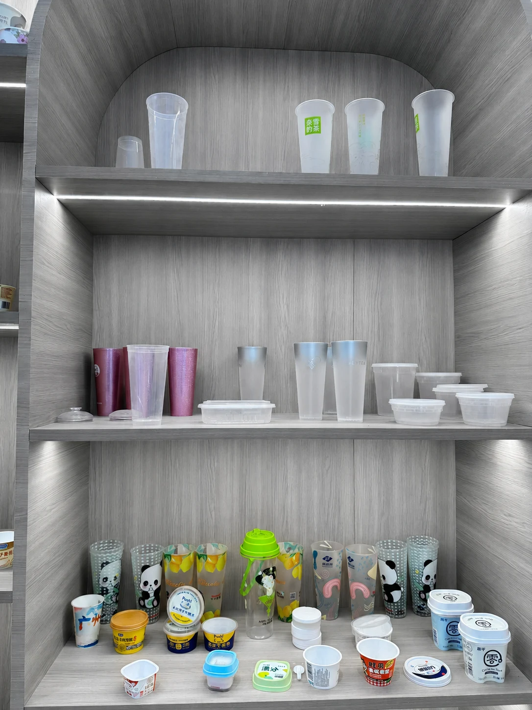 Plastic cup and container samples in different shapes, rim styles and decoration formats